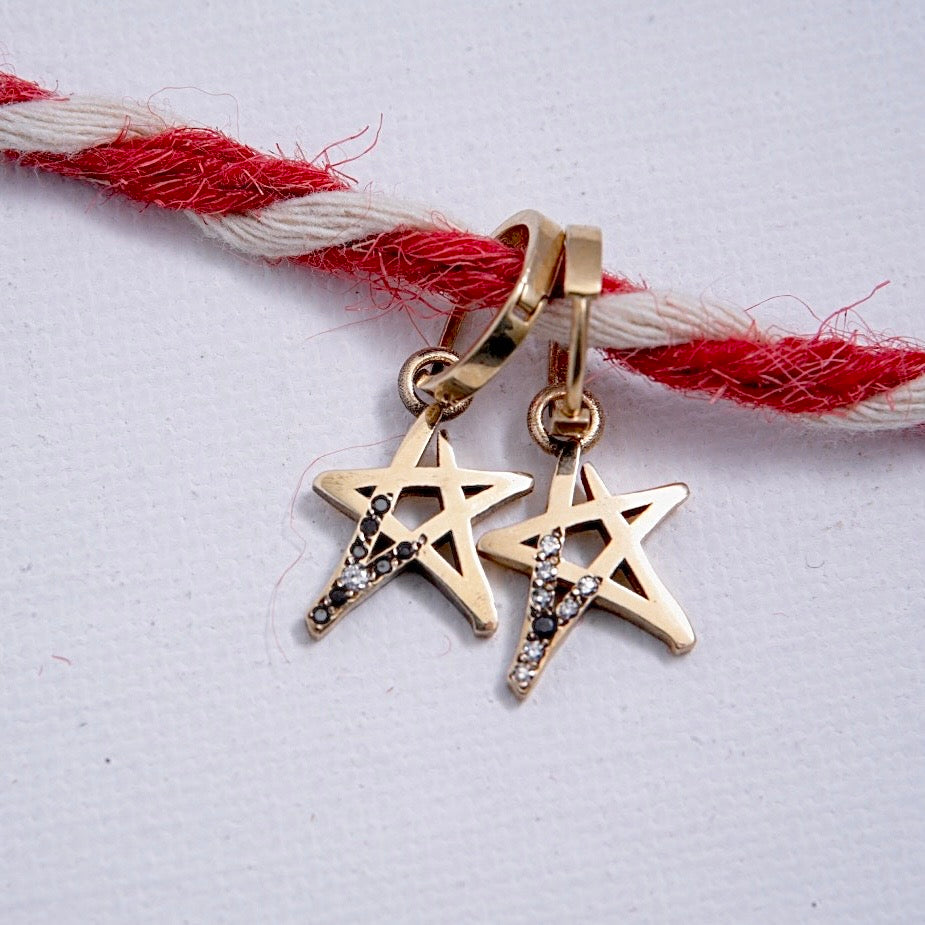 Star Earrings Adorned with white and black diamonds